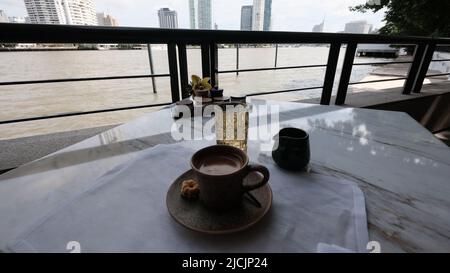 Coffee on the Chao Phraya River, Capella luxury five star hotel on Charoen Krung Road Yannawa Sathorn Bangkok Thailand Stock Photo