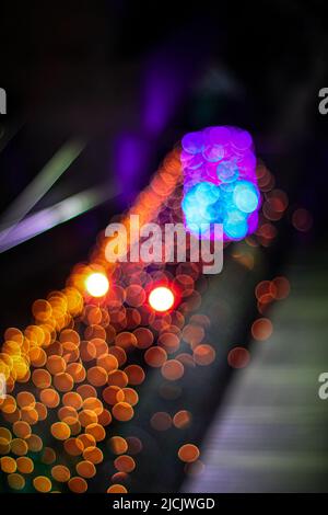 The glowing lights in the street. Stock Photo