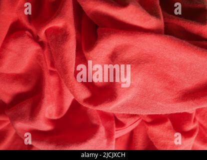 crumpled red fabric texture useful as a background Stock Photo