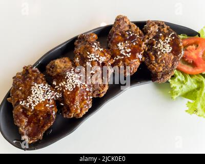 crispy fried chicken wings with soy sauce, korean style Stock Photo