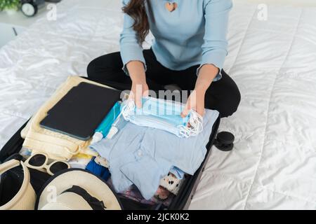 Premium Photo  Woman packing clothes in luggage for new journey