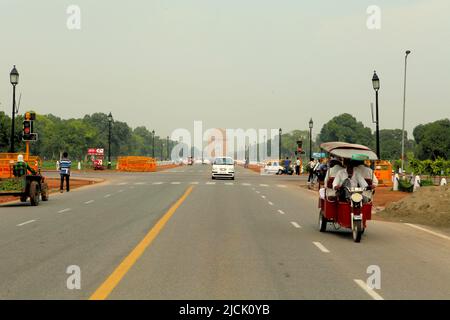 The Rajpath boulevard with India Gate can be seen in the distance in New Delhi, Delhi, India. Stock Photo