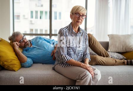 Handsome senior man and attractive old woman are having relationship problems Stock Photo