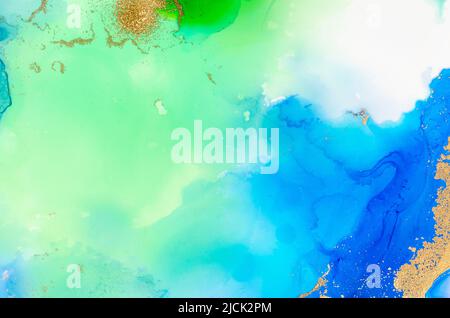 Alcohol-based ink on paper in blue and green colors on white background. Copy space. Stock Photo