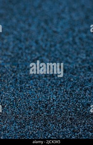 Rich dark blue metalic sequins background. Stock Photo