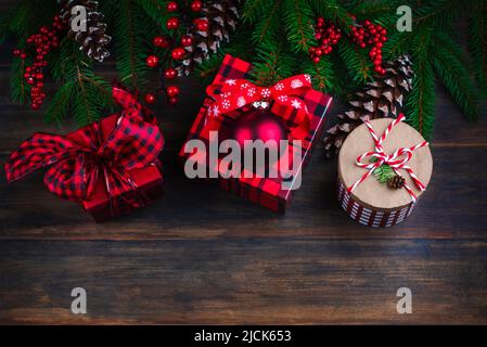 Christmas background. Fir branches and Christmas gift boxes on wooden blue background, copy space. Stock Photo