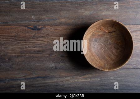Wooden laminate parquet floor with texture and bamboo wooden empty bowl. High quality photo Stock Photo