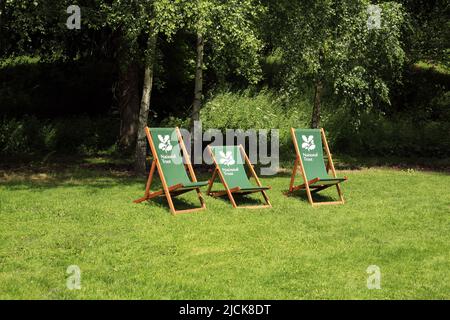 National trust deckchairs for visitors use at the Weir garden, Hereford, England, UK. Stock Photo