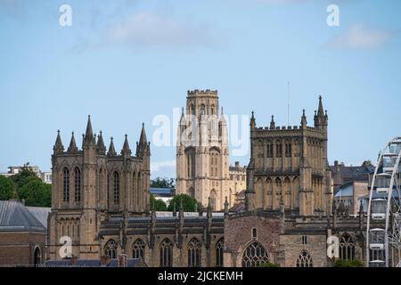 The Wills Memorial Building tower at Bristol University is seen behind Bristol Cathedral on a sunny day. The tower stands at the top of Park Street. Stock Photo