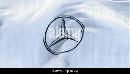 Stuttgart, Germany, June 2022: White flag with the Mercedes-Benz logo waving in the wind. Stock Photo