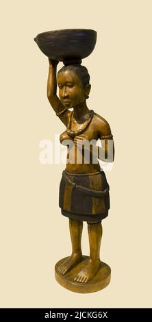 Beijing central gifts cultural relics management center - 2008 woodcarving women like - guinea Bissau Stock Photo