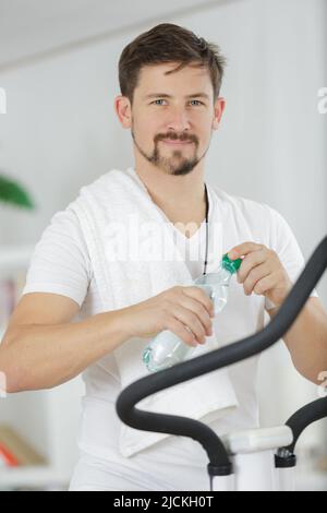young man having a break in his gym workout Stock Photo
