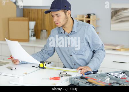 handsome concentrated professional checking plans Stock Photo