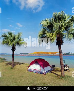 Guangdong maoming open-pit mine ecological camping in the park Stock Photo