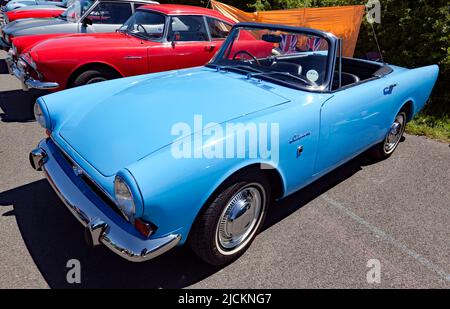 Three-quarters front view of a Blue, 1968, Sunbeam Alpine, on display at the Deal Classic Car Show 2022 Stock Photo