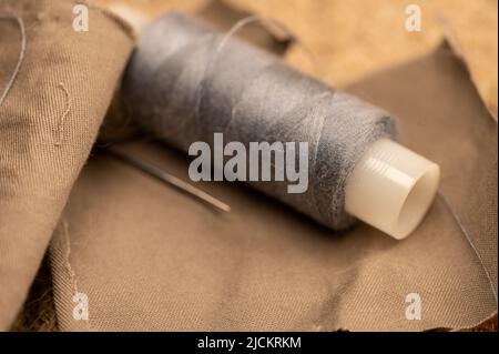 Threading a sewing needle illustration hi-res stock photography
