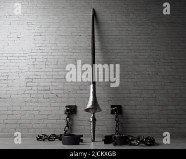 A play on words concept showing an upstanding medieval wooden lance released from iron shackles connected to an isolated brick wall  - 3D render Stock Photo