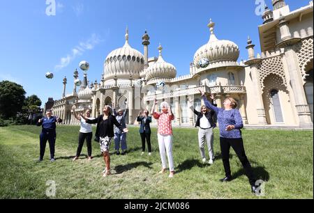 Brighton, UK. 14th June, 2022. Goal Power Women's Football 1894-2022 Exhibition launch outside the Royal Pavillion in Brighton. L-R Chris Lockwood, Maggie Murphy, Rose Reilly, Leah Caleb, Kelly Simmons, June Jaycocks, Gill Sayell and Eileen Bourne Credit: James Boardman/Alamy Live News Stock Photo