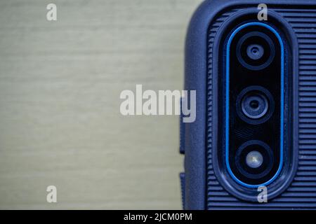 Close up shot of the back of a smartphone, with a group of cameras. Stock Photo