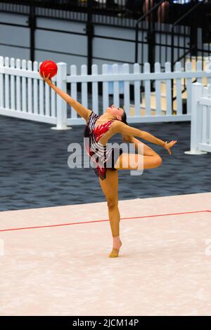 Australian Senior International Rhythmic Gymnast, Ashari Gill, starting  pose of a hoop routine during 2022 Oceania Rhythmic Gymnastics Continental  Championships. The event was running in parallel with Australian Gymnastics  Championships on Gold