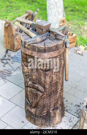 Old rusty blacksmith tools at the outdoors, close up. Blacksmith working space Stock Photo