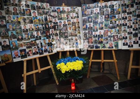 Photos of Ukrainian soldiers killed during the war seen displayed in a church in Lviv. Heavy fighting continues in eastern Ukraine, with key locations under intense bombardment from Russian forces. Russia has made slow but significant advances in the east, and now controls over 90% of the Luhansk region. As death continues to rise, the western region of Ukraine like the city of Lviv held memorials for the decreased almost every day since the beginning of the war, and there is no ending in a short period of time. (Photo by Dominic Chiu/SOPA Images/Sipa USA) Stock Photo