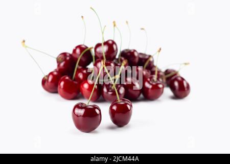 Fresh cherry fruit isolated on bright background. Selective focus. Stock Photo
