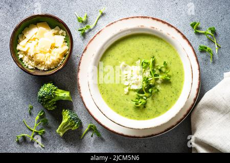 Broccoli cream soup with cream and parmesan. Stock Photo