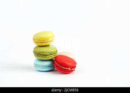 Stack of colourful macaroons or macaron isolated on white, French dessert background. Stock Photo