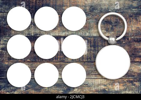 Keychain mockup to display Your design. Key chain mock up on rustic wooden background Stock Photo