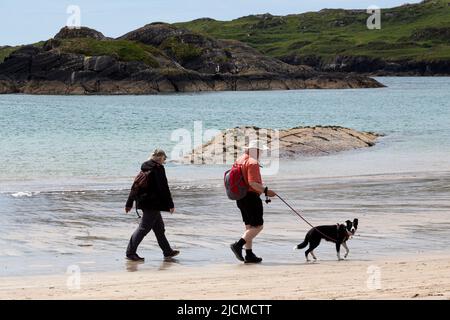 Ring of Kerry, Ireland, 14/06/2022, People walking on Derrynane Strand beach, Ring of Kerry, Ireland Stock Photo