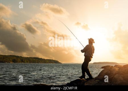 Fishing Rod Wheel Fisherman Fishing Spinning On Canal At Sunset Stock Photo  - Download Image Now - iStock