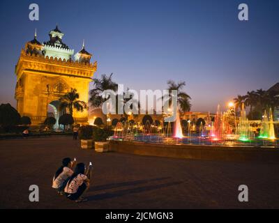 A water and light display in front of Patuxai (Victory Gate), Vientiane, Laos P.D.R. Stock Photo