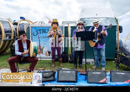 Live music being played by bands to the the passing visitors at the Royal Cornwall Show. Upbeat, joyful, entertaining and involving all ages. Stock Photo