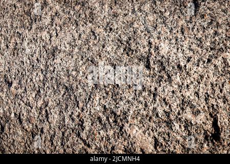 Stone background. Brown rough solid rocky material. Natural porous surface. High quality photo Stock Photo