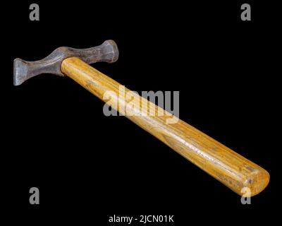 Used rusty hammer with wooden handle isolated on black background Stock Photo