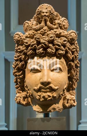 Terracotta head of a Bodhisattva made around the 4th century in Gandhara (present day Pakistan and Afghanistan).  Asian Civilisations Museum, Republic Stock Photo