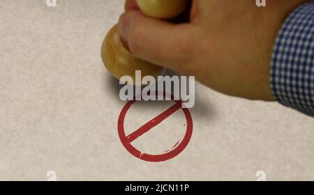 Banned stamp and stamping hand. Ban, restricted and prohibited symbol concept. Stock Photo