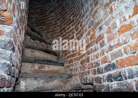 Half-ruined stairs in the ancient tower. Stairs in the ruined tower Stock Photo