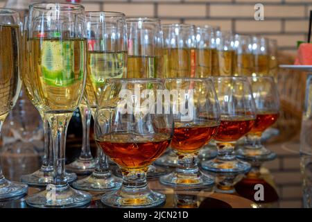 Lots of different glasses with white and red wine. Stock Photo