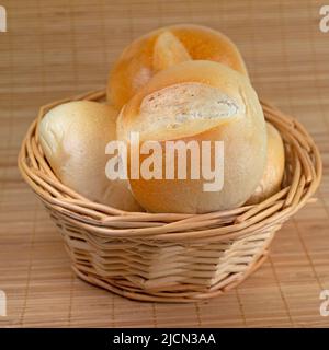 Wheat buns in the basket Stock Photo