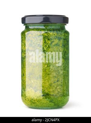 Glass unlabeled jar of green pesto sauce isolated on white Stock Photo