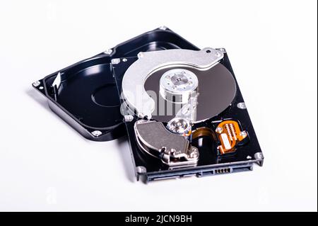 internal parts of a hard disk isolated on a white background, closeup of hard disk drive inside view Stock Photo