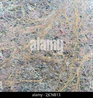 Marble with a dense network of veins on the surface Stock Photo