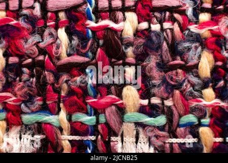 Texture of fabric from multi-colored threads for knitting. Fabric for tailoring. Colored thread pattern Stock Photo