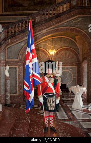 An officer with the colours of the 92nd (Gordon Highlanders) Regiment of Foot at the Duchess of Richmond's ball at Egmont Palace in Brussels, Belgium Stock Photo