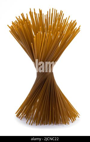 Spiral Bunch of Whole Wheat Noodles Cut Out on White. Stock Photo