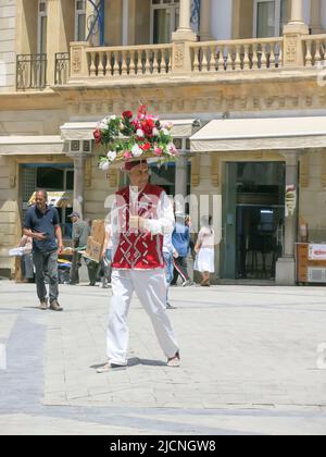 Flower Vendor in Front of Hotel Victoria at Main Medina Entrance Gate Stock Photo