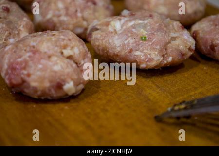 Raw meatballs on the board Stock Photo