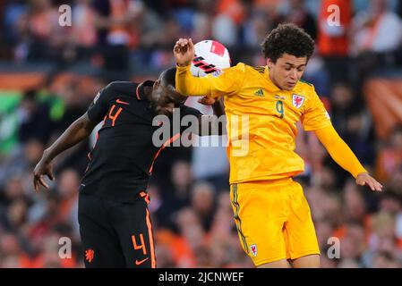 Rotterdam, Netherlands. 14th June, 2022. Bruno Martins Indi (L) of the Netherlands vies with Brennan Johnson of Wales during the football match of Group 4 in League A of the UEFA Nations League between the Netherlands and Wales in Rotterdam, the Netherlands, June 14, 2022. Credit: Zheng Huansong/Xinhua/Alamy Live News Stock Photo